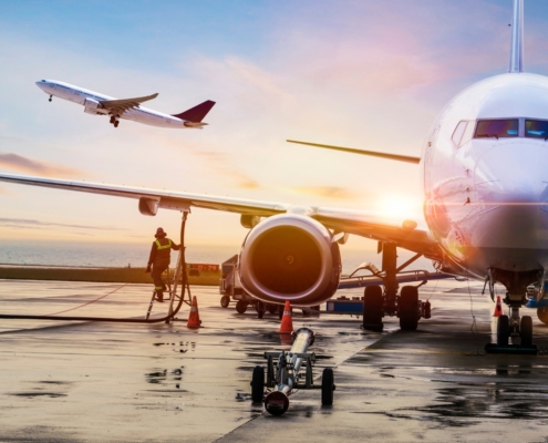 Airplane at sunrise preparing for departure, symbolizing formal tax exit and international relocation from South Africa.